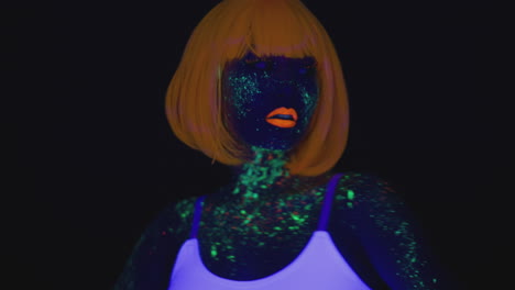 woman with neon makeup and fluorescent hair