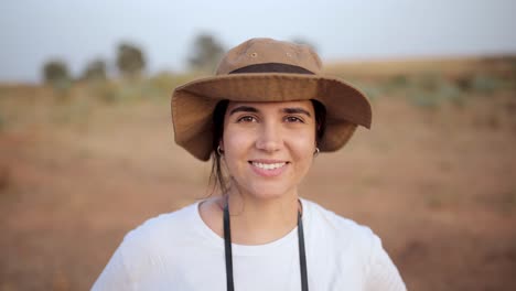 woman standing in desert field