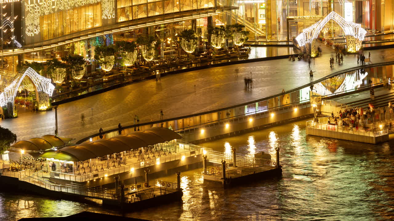 Night View of a City Waterfront with Shopping Mall and Docks