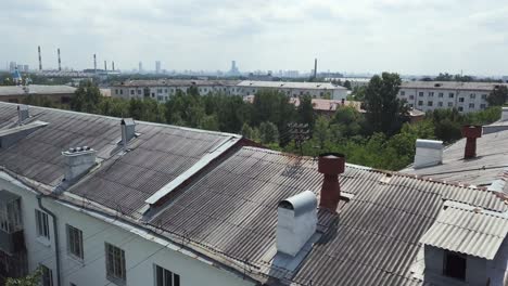 cityscape with apartment buildings and gray roofs