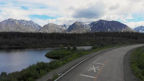 4k drone video of mountain peaks and granite creek near denali national park in alaska on sunny summer day