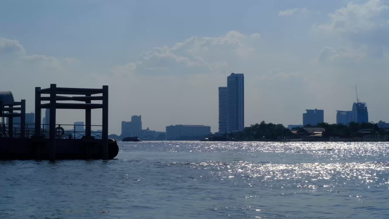 Passenger boat stations water float. The nice sun light water surface reflexion of river. Chao Phraya River of Thailand. Land of smile.