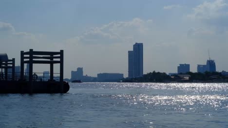 passenger boat stations water float. the nice sun light water surface reflexion of river. chao phraya river of thailand. land of smile.