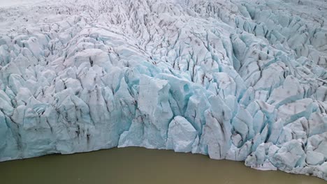 aerial pullback reveals large glacier melting due to climate change