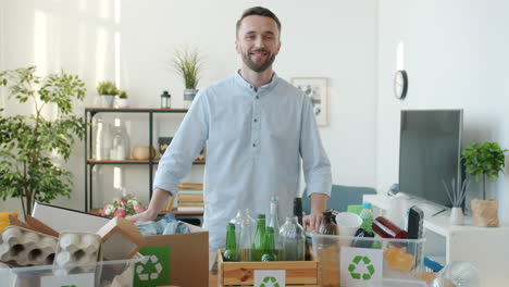 man recycling at home