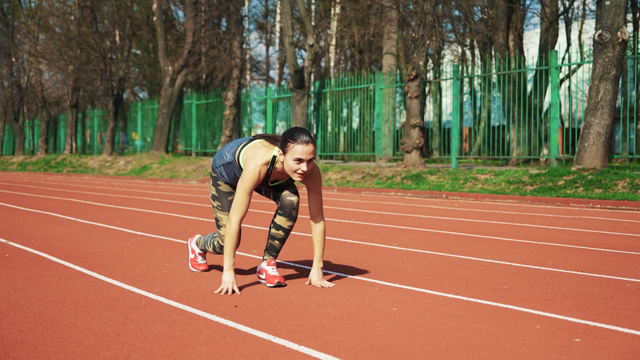 Sport reaction video Athletes at starting position preparing for run at the stadium. Healthy fitness lifestyle