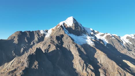 Flying-view-of-the-mountains,-snow-capped-La-Veronica,-Sacred-Valley,-Cusco