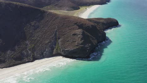 drone rotates over the tecolote beach cliffs in baja, mexico