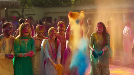 people celebrating holi festival with vibrant powder