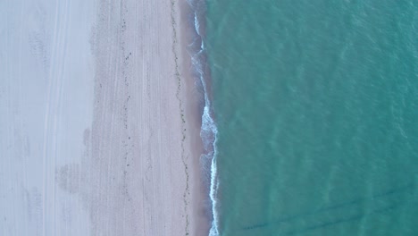 aerial dolly forward shot of north sea after sunset