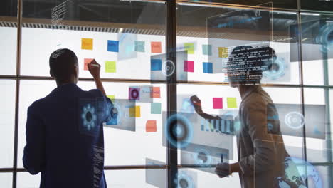 collaborating on animation project, two people using colorful sticky notes in school