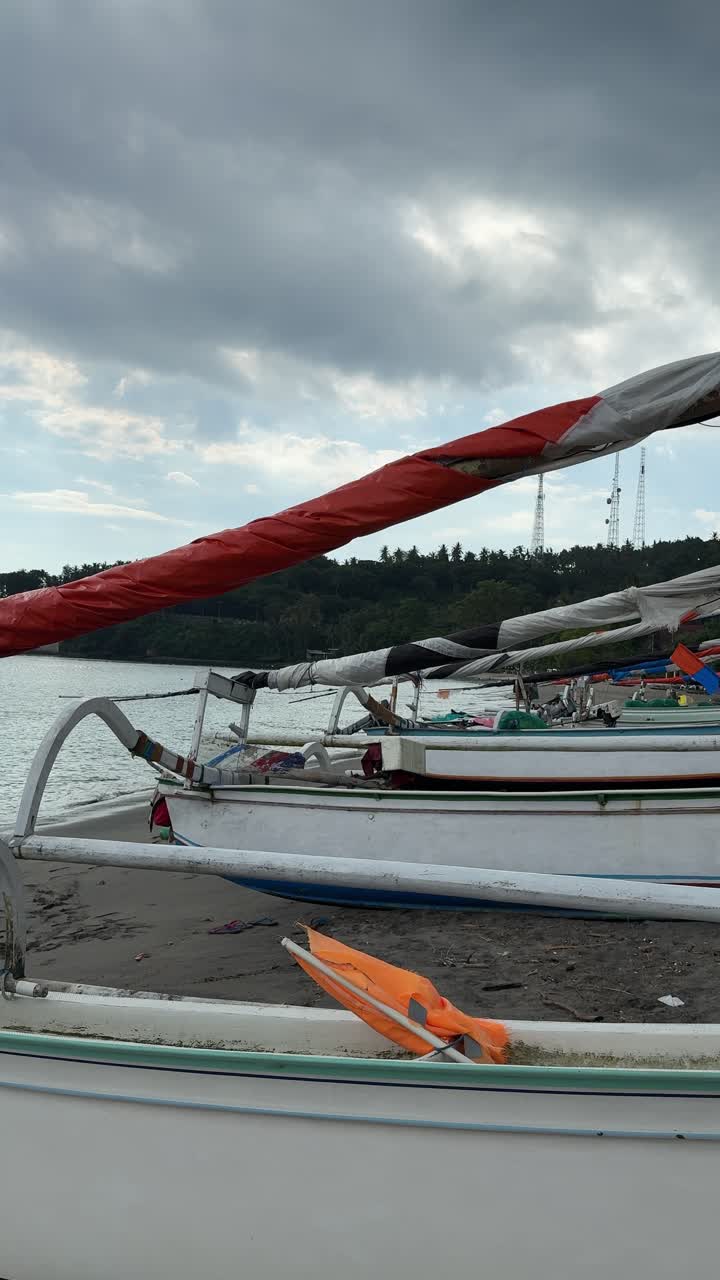 Traditional Jukung Fishing Boats Parked on a Tropical Beach