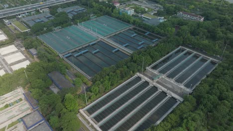 Drone-shot-circling-buildings-in-Zhujiang-New-Town,-in-sunny-Guangzhou,-China