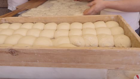 preparing dough in a wooden box