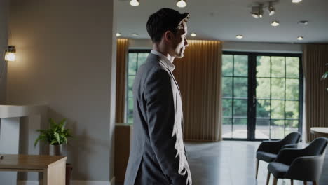 businessman walking through modern interior