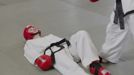 two athetes wearing dobok and protection