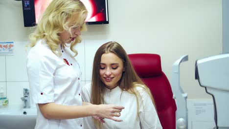 doctor explains the results to a patient. an ophthalmologist confirms good results to a woman after the ophthalmic examinations.