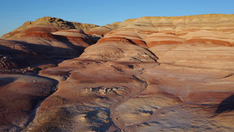 Beautiful-red-moonscape-rock-landscape-of-Utah-on-a-sunny-day---Aerial