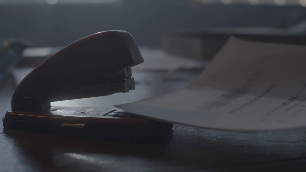Stapler on a Desk with Papers