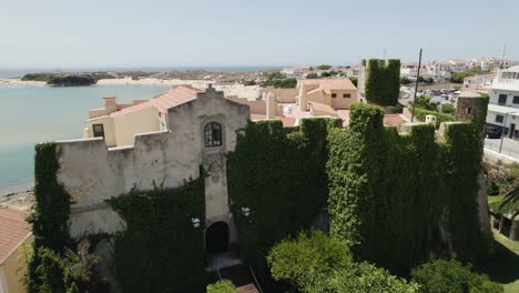 Aerial-view-showing-Forte-de-São-Clemente-in-foreground-with-resorts-and-hotels-along-the-coastal-beach-of-Mira-river