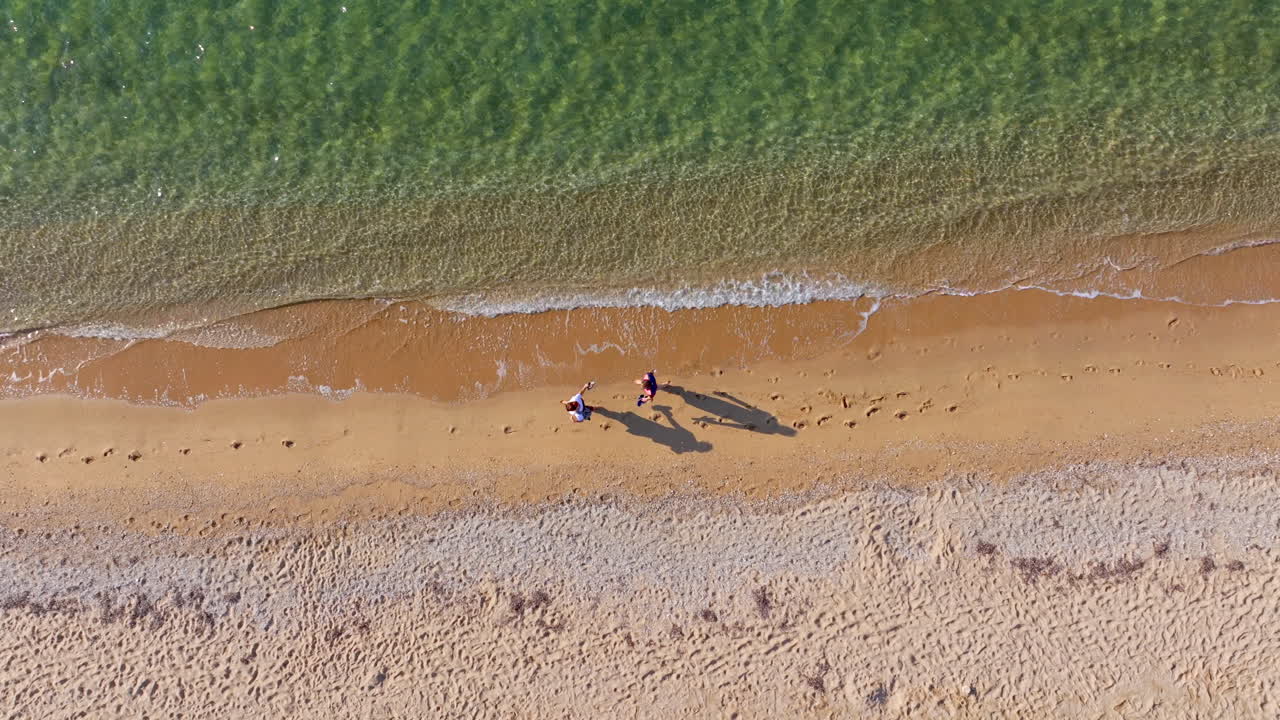Aerial view of two people on a beach