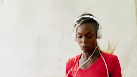 Fit-woman-exercising-with-headphones