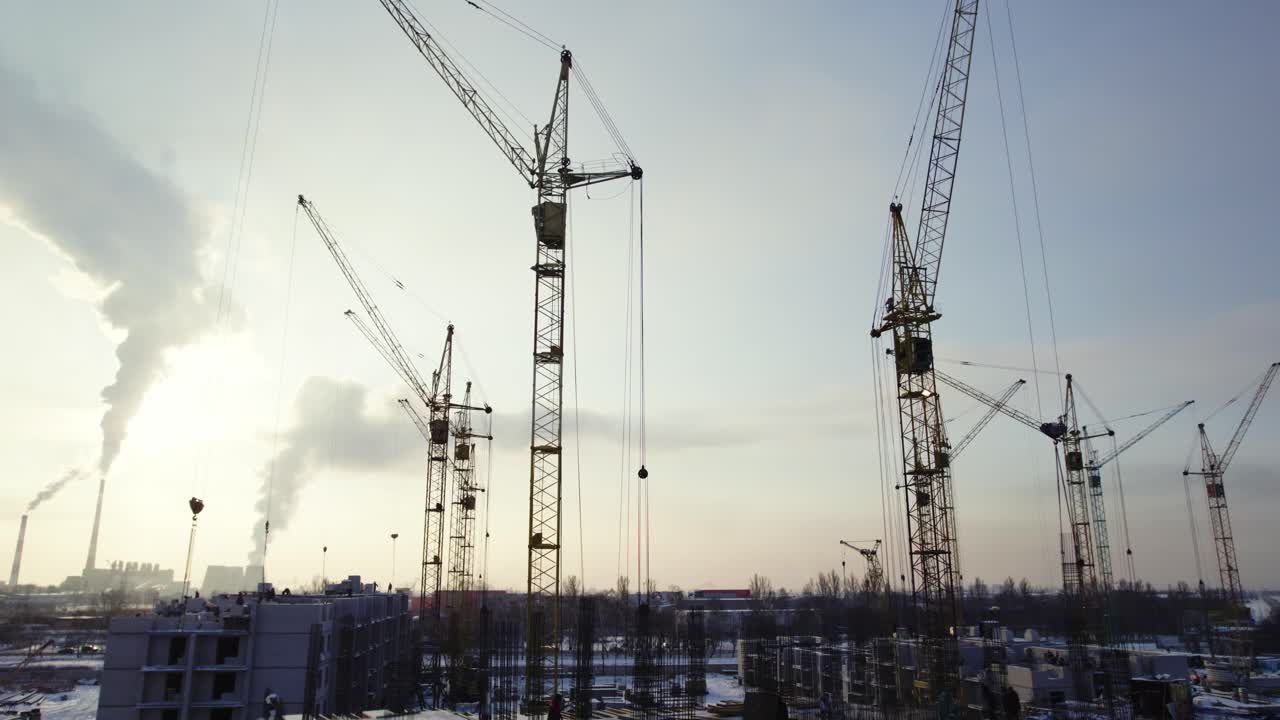 Construction Site with Cranes in Winter