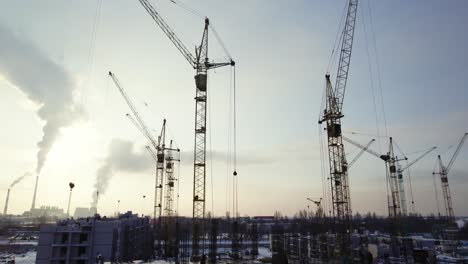 construction site with cranes in winter