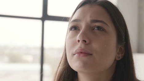 Unhappy-Woman-Crying-And-Drying-Her-Tears-At-Home