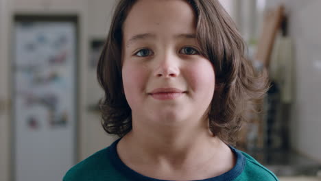 portrait-happy-little-boy-smiling-at-camera-friendly-child-at-home-in-kitchen