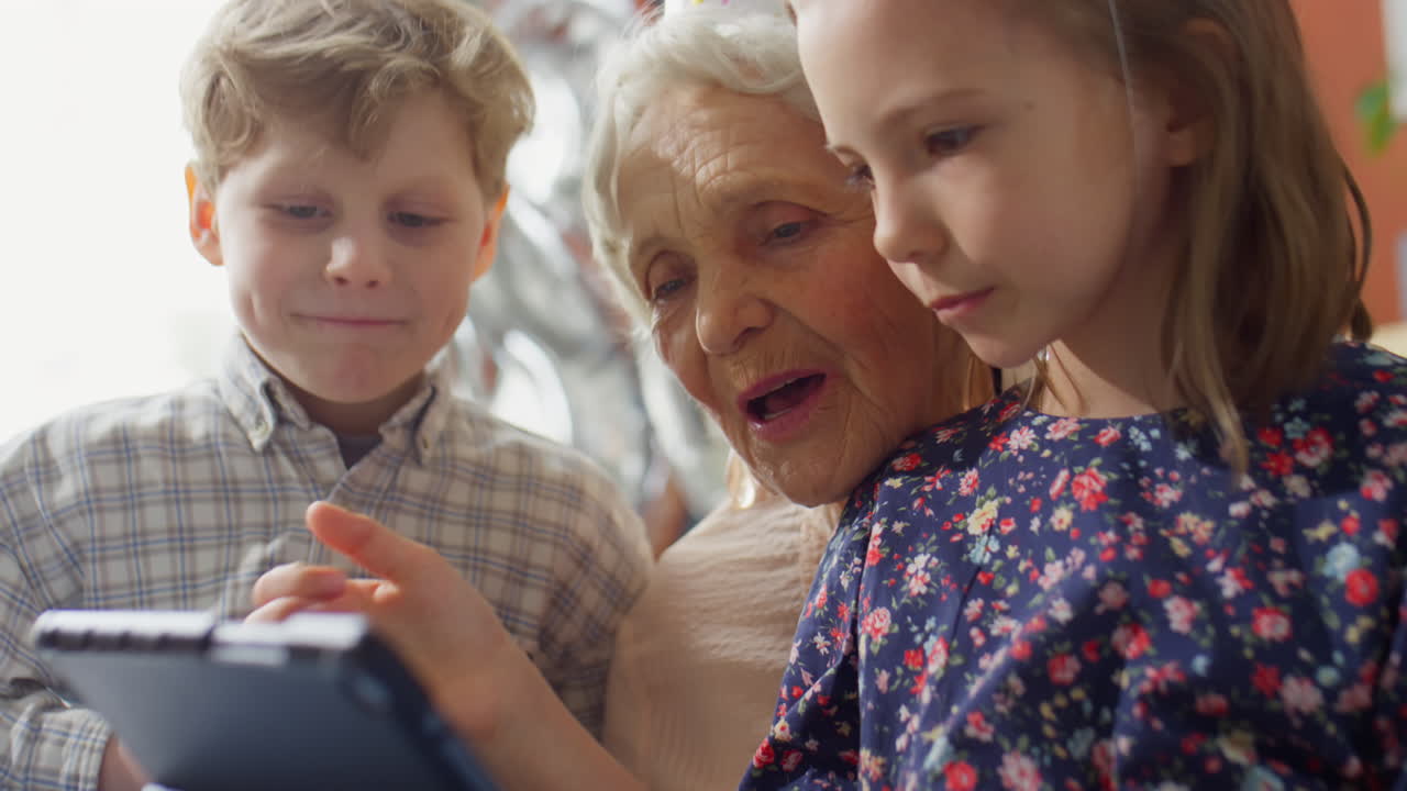Grandmother and Grandchildren Celebrating a Birthday