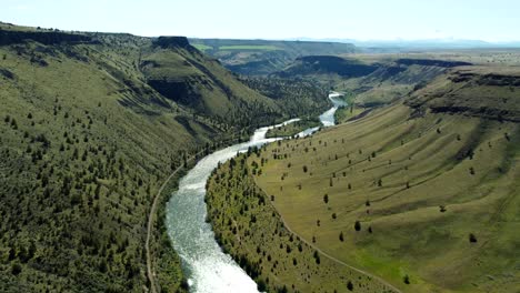us, oregon, madras, trout creek campground, 2025-04-19 - drone view flying in the canyon of the deschutes river at trout creek in central oregon. in spring at a high river flow.