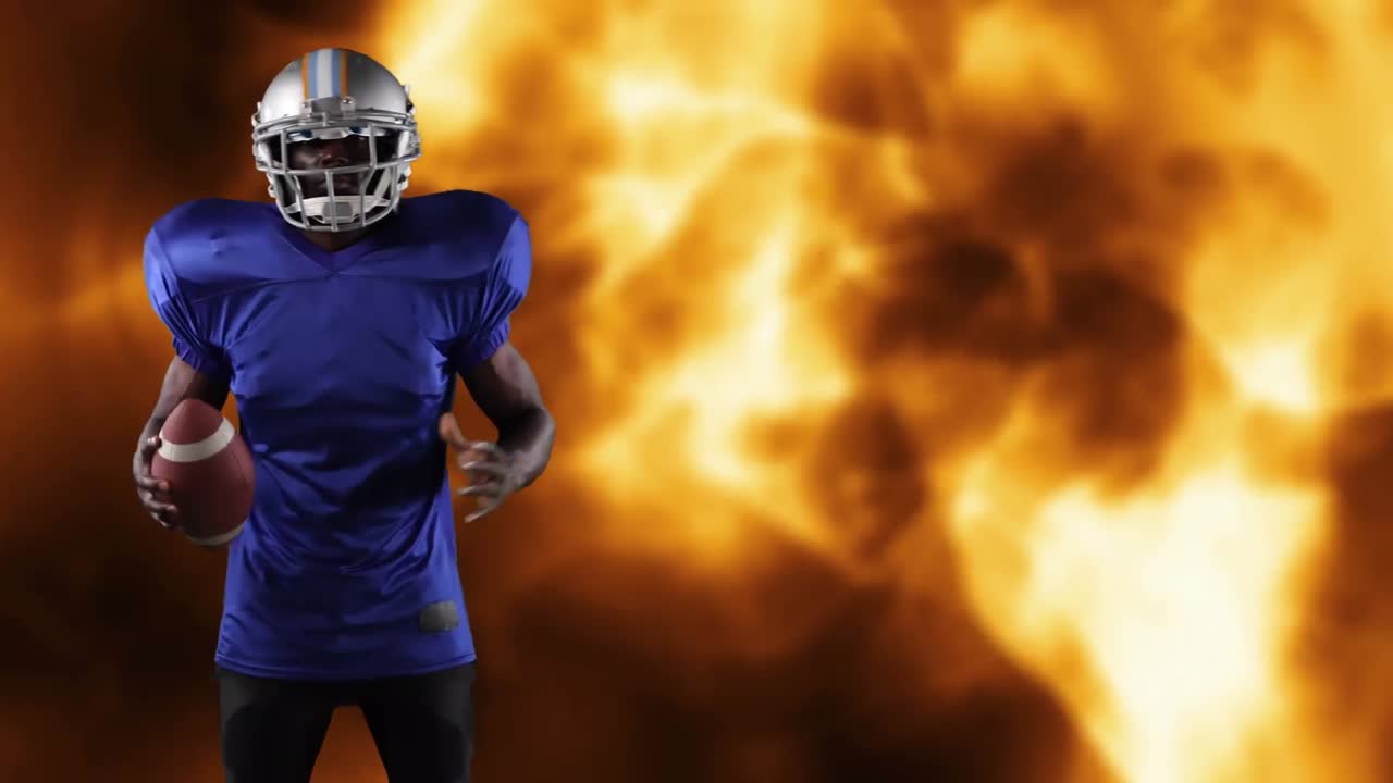 Giocatore di football americano che tiene la palla su fiamme