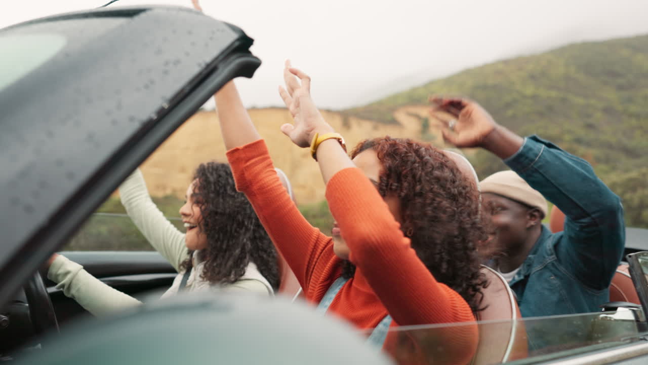 Friends enjoying a road trip in a convertible