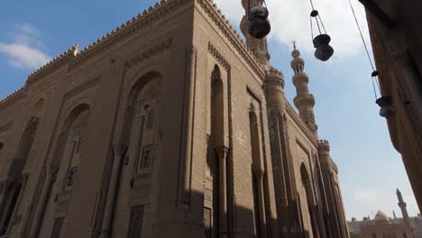 magnificent exterior of mosque-madrasa of sultan hassan and al-rifa'i mosque, cairo, egypt. panning shot