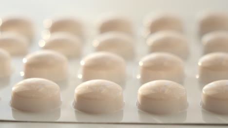 close up of pills of blister pack on table