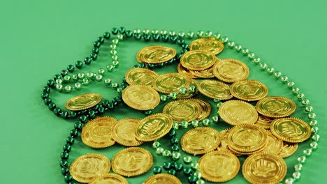 Leprechauns-gold-and-green-necklace-on-green-background-for-st-patricks