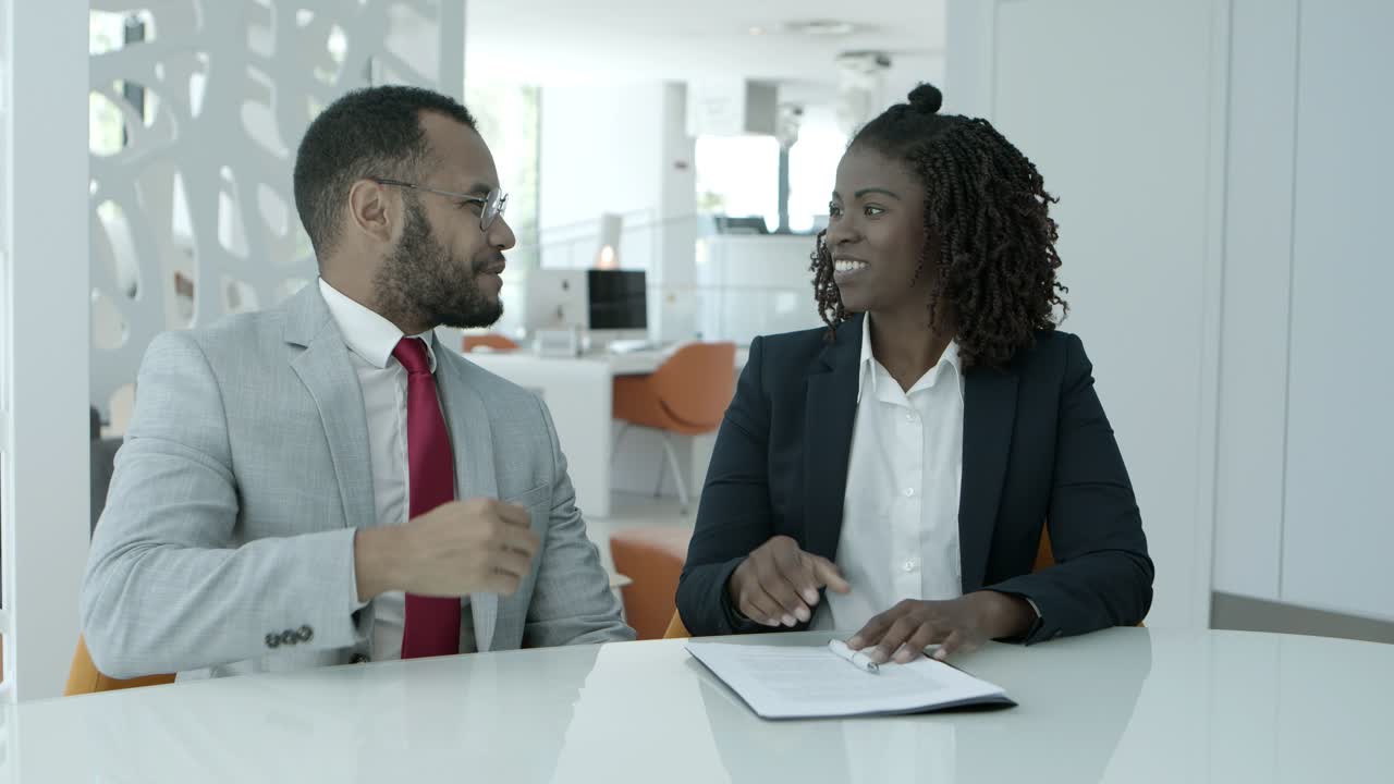 Business colleagues shaking hands