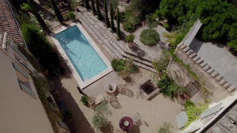 aerial view from the roof of a villa in the south of france on its private garden terrace with swimming pool