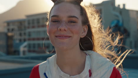 portrait happy woman smiling beautiful teenage girl with red hair looking happy with wind blowing hair enjoying positive self image in city at sunset