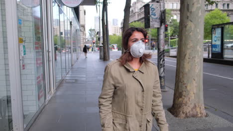 walking with mask down city street during pandemic