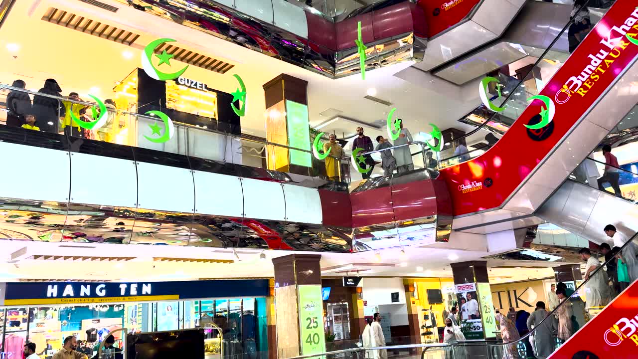 Shoppers explore Centaurus Mall, adorned with vibrant decorations for Independence Day celebrations.