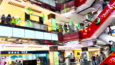 shoppers explore centaurus mall, adorned with vibrant decorations for independence day celebrations.