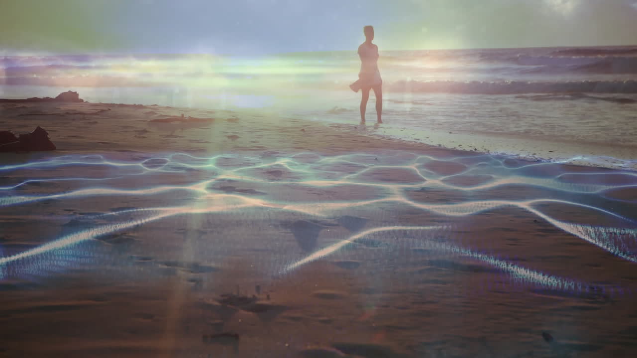 Walking on beach, person surrounded by animation of abstract light patterns