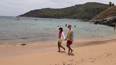 couple walking on a tropical beach