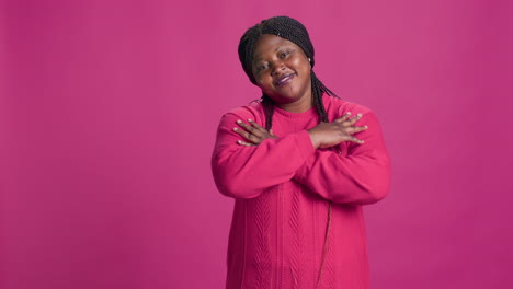 Woman-Posing-Against-Pink-Background