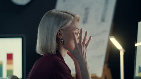 overworked business woman throwing up document paper in night office