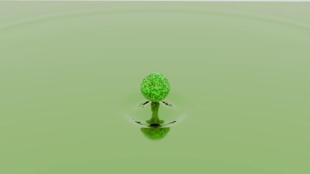 녹색 구가 액체 표면에 떨어지는 것