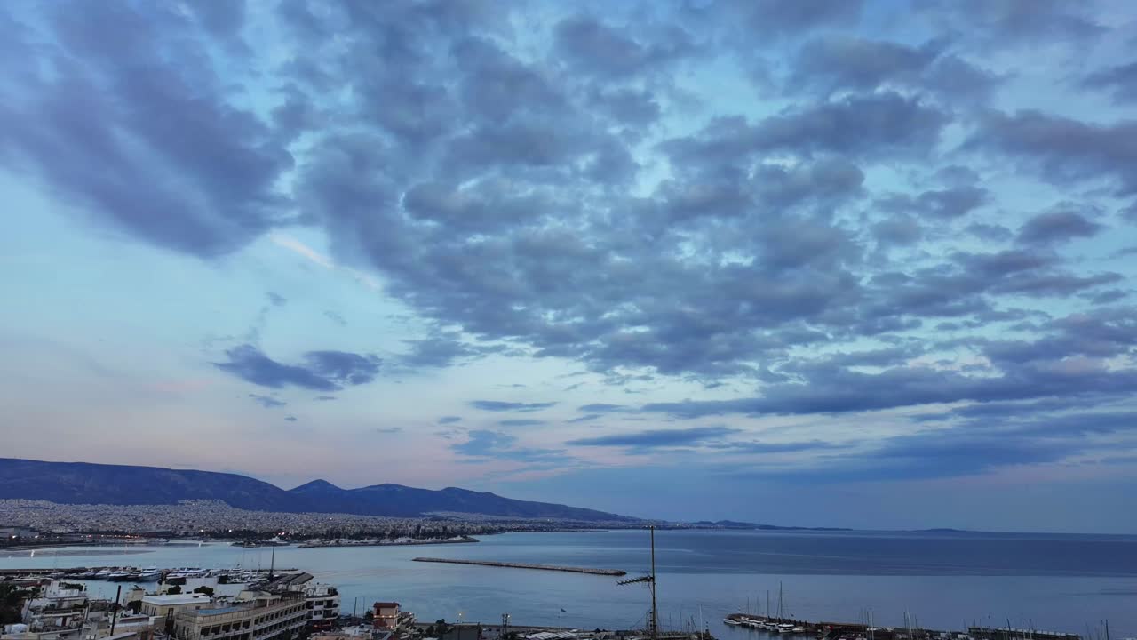 Cityscape at Dusk with Clouds and Sea