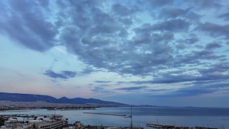 cityscape at dusk with clouds and sea